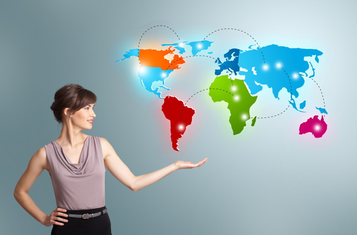 Beautiful young woman presenting colorful world map